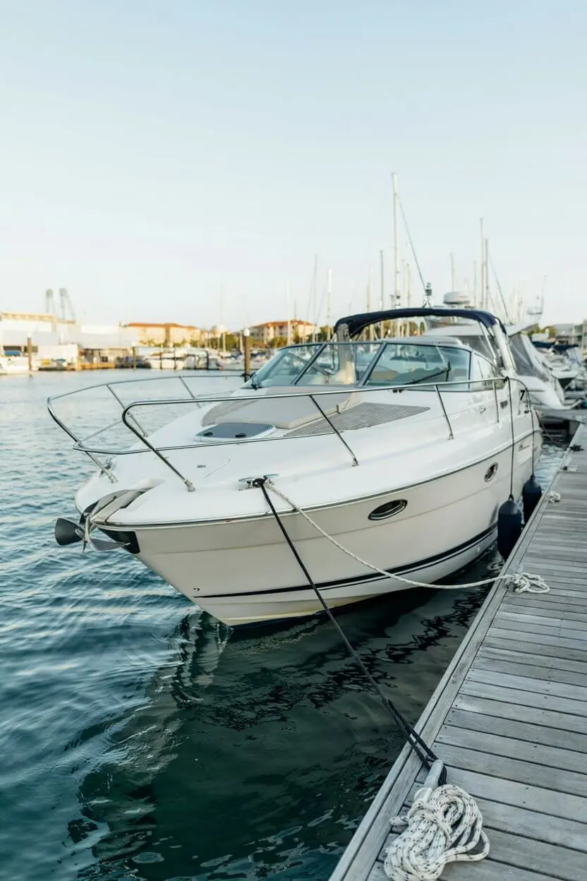 Boat Mooring Lines Guide 2026 showing a recreational boat secured to a marina dock with nylon mooring lines